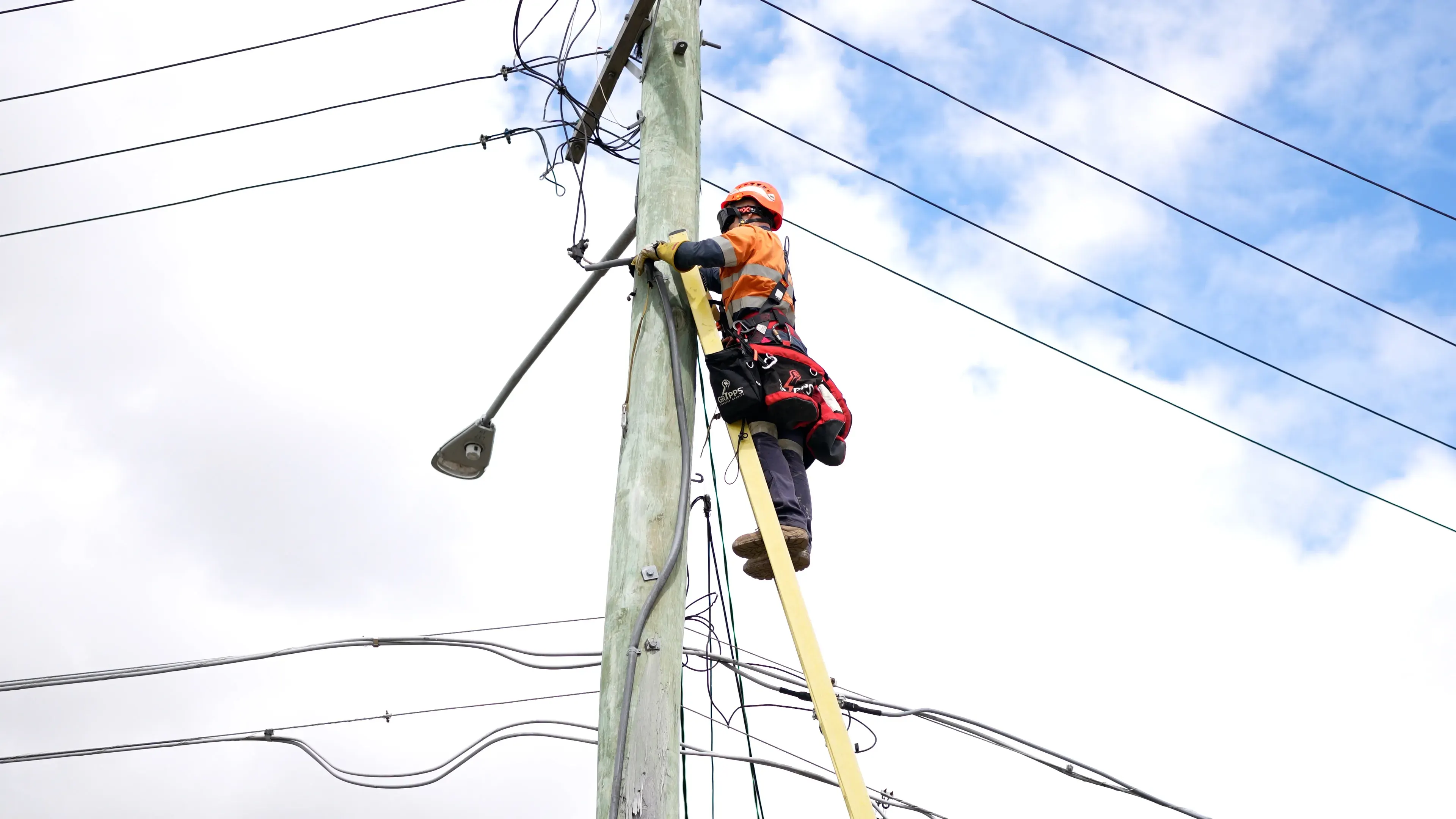 Level 2 electrician Maitland: accredited provider working on overhead service lines at the point of attachment